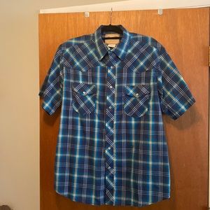 Wrangler blue plaid shirt sleeve. Pearl snaps